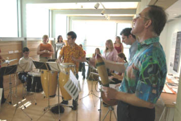 Nigel Morgan and percussionist Matt Williamson lead children from City High School Wakefield in Rhythm of the Stones - the education project linked to the Barbara Hepworth Centenary exhibition.